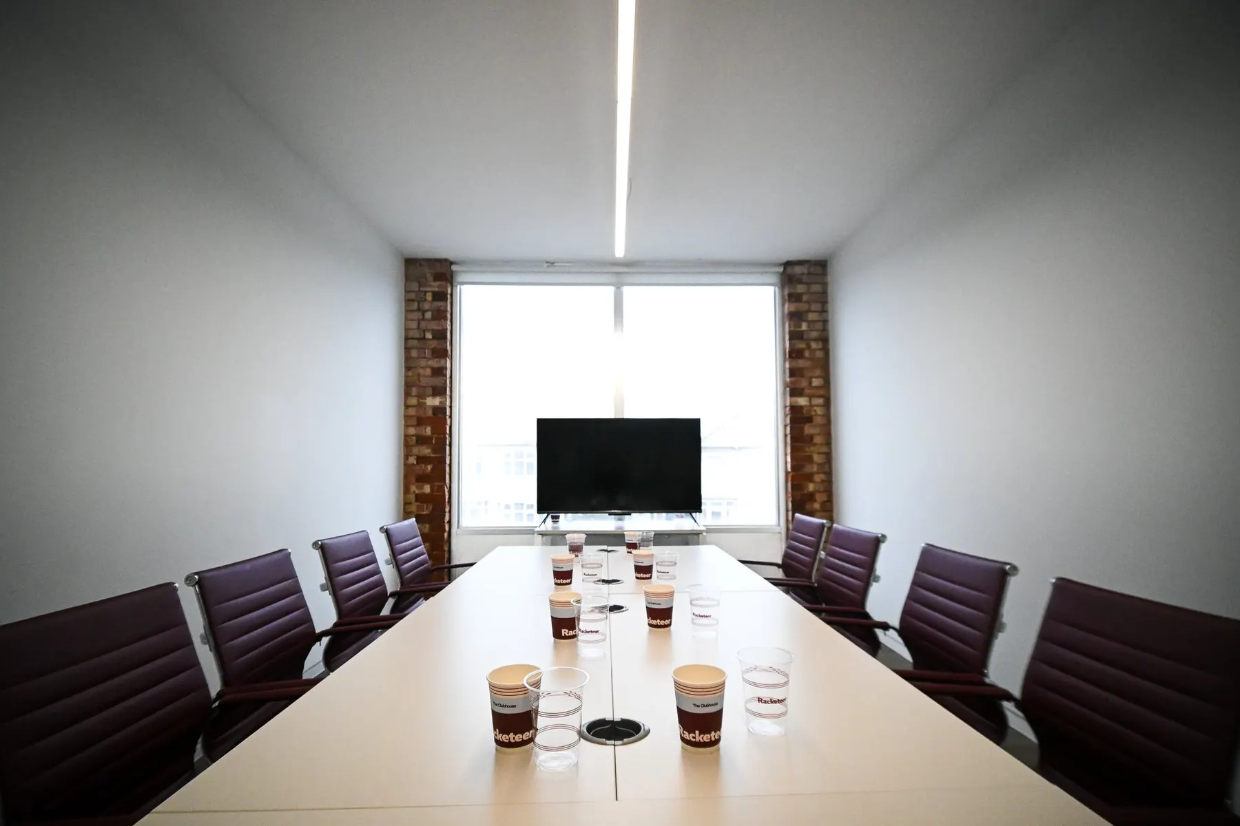 A first-floor room set up for a meeting.